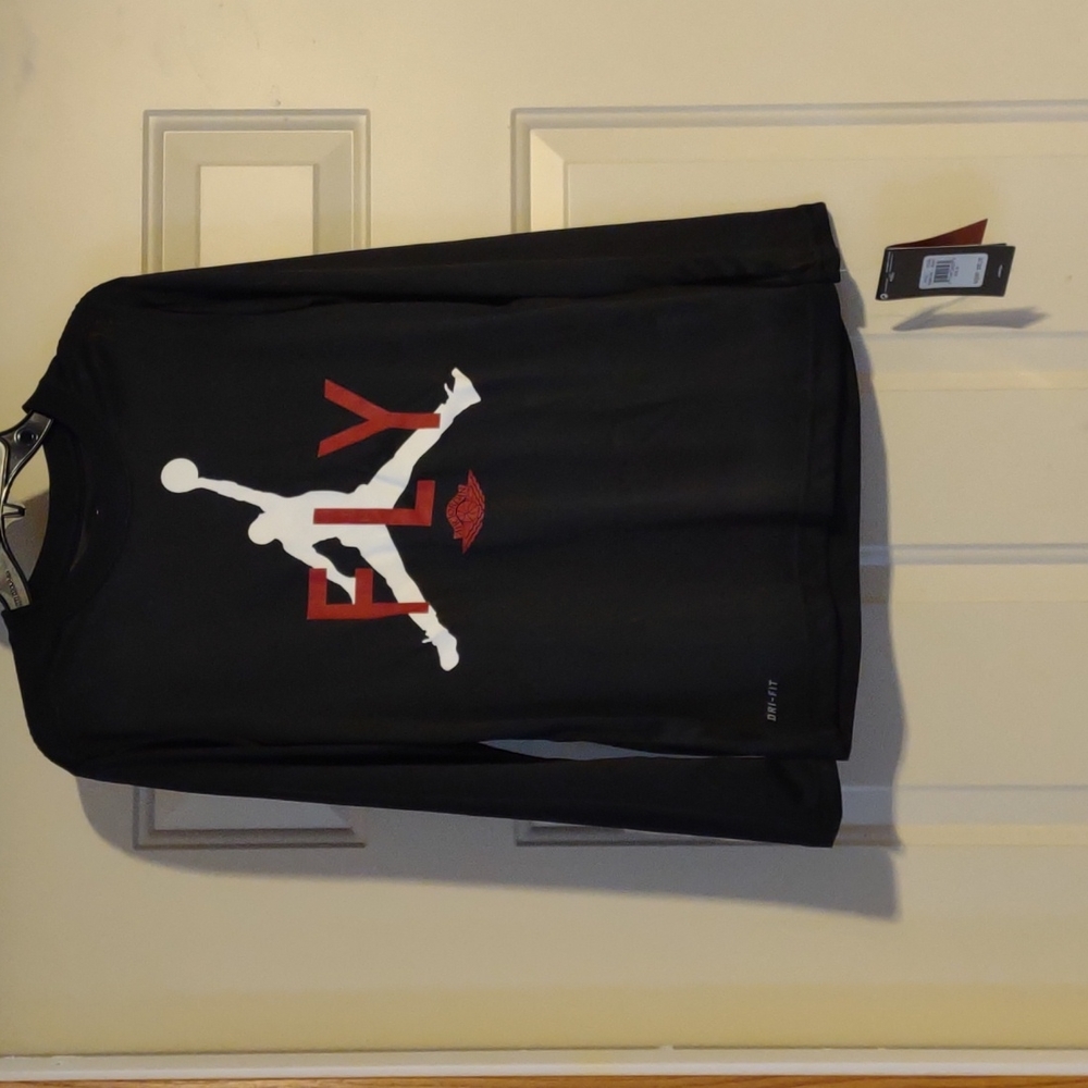 Black long sleeve Air Jordan Dri-fit shirt.  New with tags.  Boys size Medium.